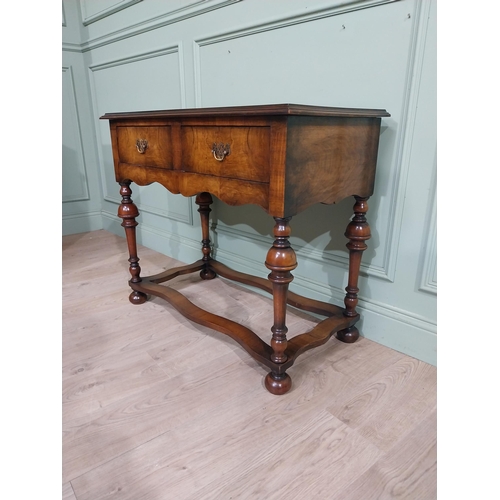 485 - Edwardian walnut side table in the Tudor style with two drawers in frieze raised on turned legs. {77... 