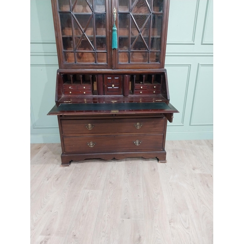 490 - Edwardian mahogany bureau bookcase raised on bracket feet with two long drawers over two short drawe... 