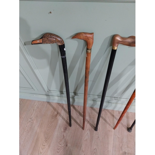 491 - Five vintage wooden walking sticks. {96 cm H}.