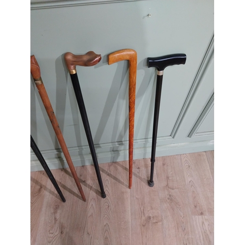 491 - Five vintage wooden walking sticks. {96 cm H}.