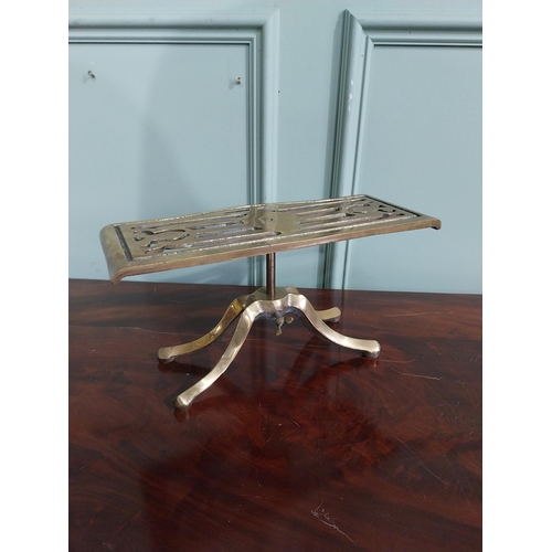 492 - Victorian style brass trivet on four splayed feet. { 16 cm H x 30 cm W x 14 cm D}.