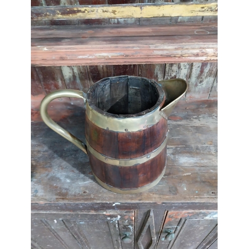 50 - 19th C. Brass bound oak water jug. {{28 cm H x 35 cm W x 20 cm D}.