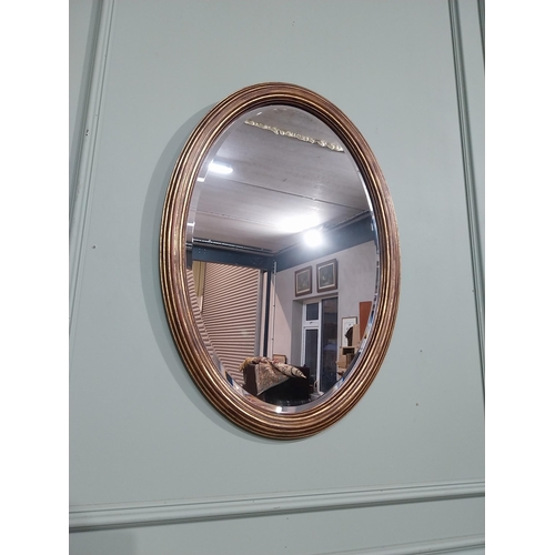 51 - Good quality oval gilt wall mirror in the Regency style. {75 cm H x 57 cm W}.