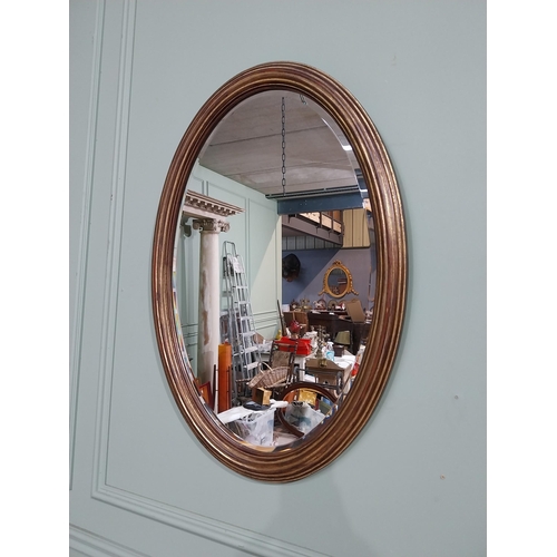 51 - Good quality oval gilt wall mirror in the Regency style. {75 cm H x 57 cm W}.