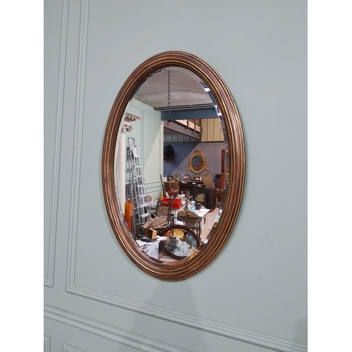 51 - Good quality oval gilt wall mirror in the Regency style. {75 cm H x 57 cm W}.