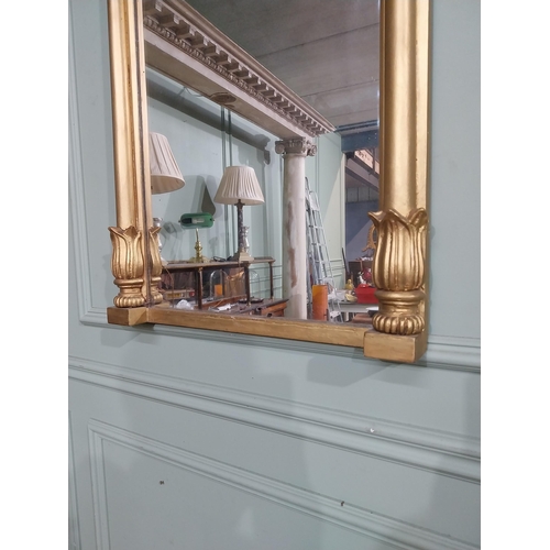 56 - Regency gilt wood pier wall mirror decorated with foliage and flanked by two shaped columns. {96 cm ... 