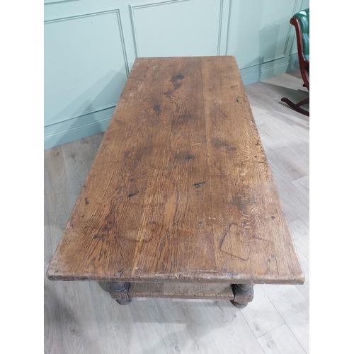 58 - 19th C. Oak kitchen table on turned legs with single stretcher. {76 cm H x 200 cm W x 85 cm D}.