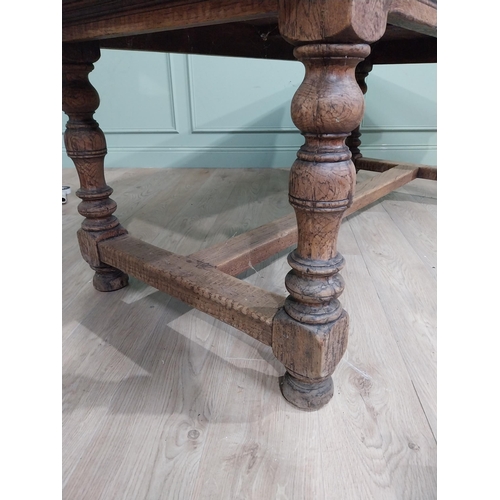 58 - 19th C. Oak kitchen table on turned legs with single stretcher. {76 cm H x 200 cm W x 85 cm D}.