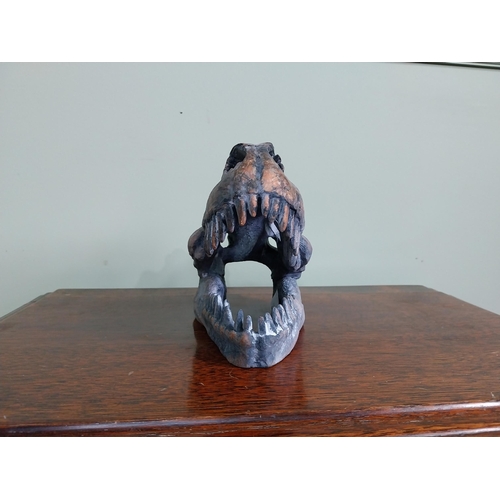 65 - Resin model of a Dinosaur skull. {15 cm H x 12 cm W x 20 cm D}.