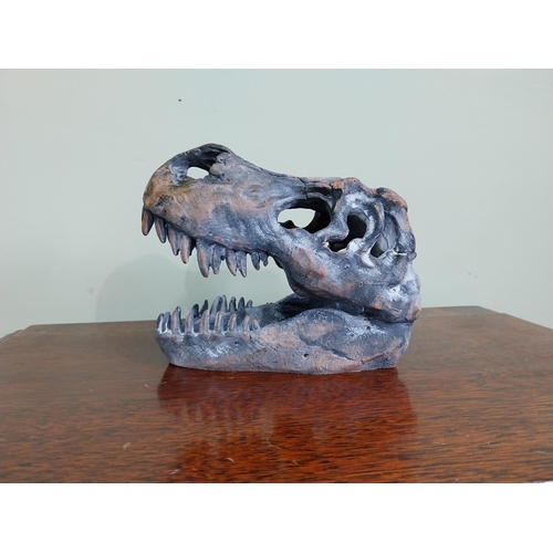 65 - Resin model of a Dinosaur skull. {15 cm H x 12 cm W x 20 cm D}.