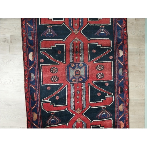 70 - Decorative Persian carpet runner. {304 cm H x 111 cm W}.