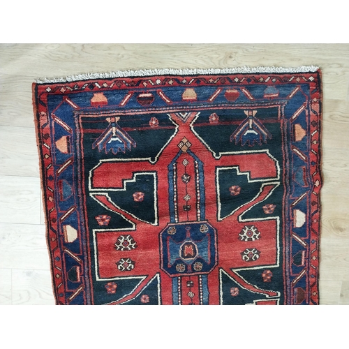 70 - Decorative Persian carpet runner. {304 cm H x 111 cm W}.