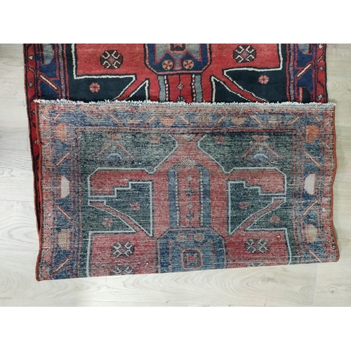 70 - Decorative Persian carpet runner. {304 cm H x 111 cm W}.