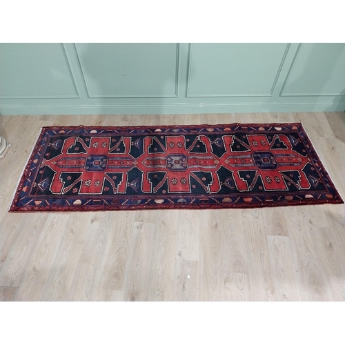 70 - Decorative Persian carpet runner. {304 cm H x 111 cm W}.