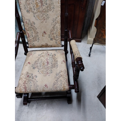 80 - Mahogany and upholstered Rocking chair in the Victorian style. {100 cm H x 54 cm W x 65 cm D}.