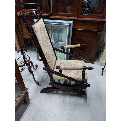 80 - Mahogany and upholstered Rocking chair in the Victorian style. {100 cm H x 54 cm W x 65 cm D}.