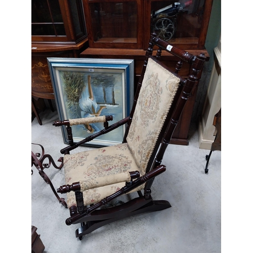 80 - Mahogany and upholstered Rocking chair in the Victorian style. {100 cm H x 54 cm W x 65 cm D}.