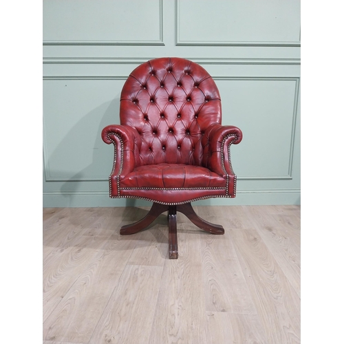 90 - Good quality hand dyed French oxblood leather deep buttoned swivel office chair raised on four splay... 