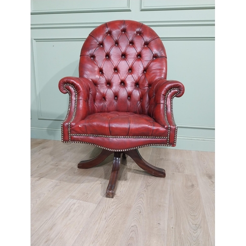 90 - Good quality hand dyed French oxblood leather deep buttoned swivel office chair raised on four splay... 