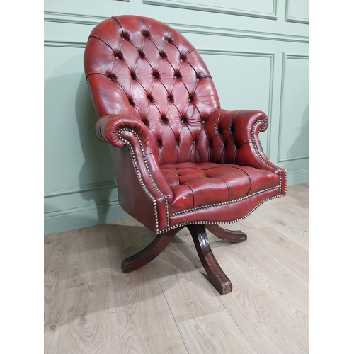 90 - Good quality hand dyed French oxblood leather deep buttoned swivel office chair raised on four splay... 