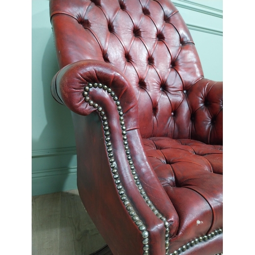 90 - Good quality hand dyed French oxblood leather deep buttoned swivel office chair raised on four splay... 