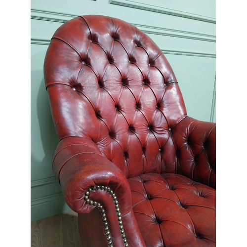 90 - Good quality hand dyed French oxblood leather deep buttoned swivel office chair raised on four splay... 