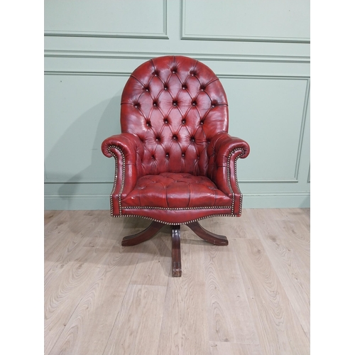 90 - Good quality hand dyed French oxblood leather deep buttoned swivel office chair raised on four splay... 