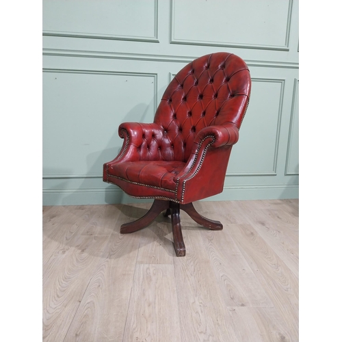 90 - Good quality hand dyed French oxblood leather deep buttoned swivel office chair raised on four splay... 