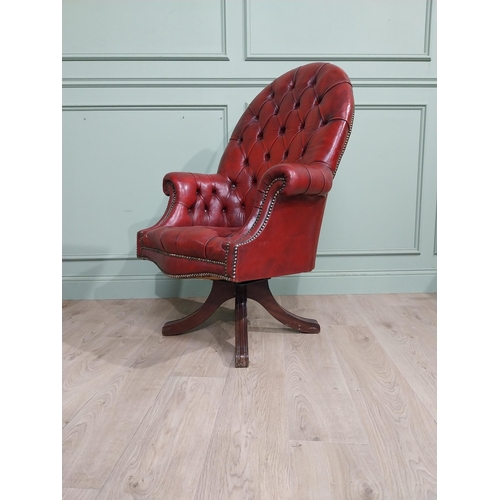 90 - Good quality hand dyed French oxblood leather deep buttoned swivel office chair raised on four splay... 