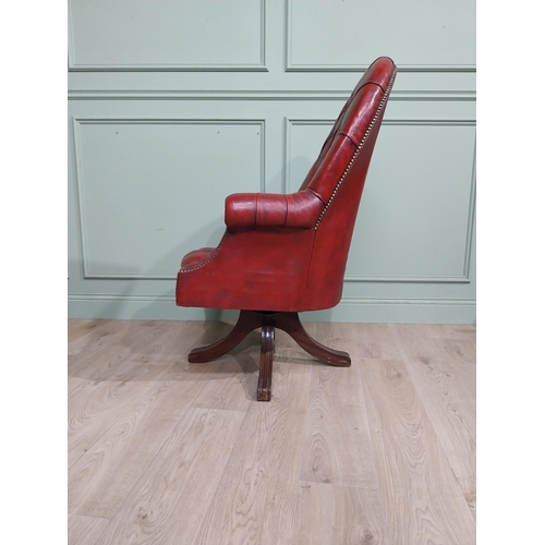 90 - Good quality hand dyed French oxblood leather deep buttoned swivel office chair raised on four splay... 