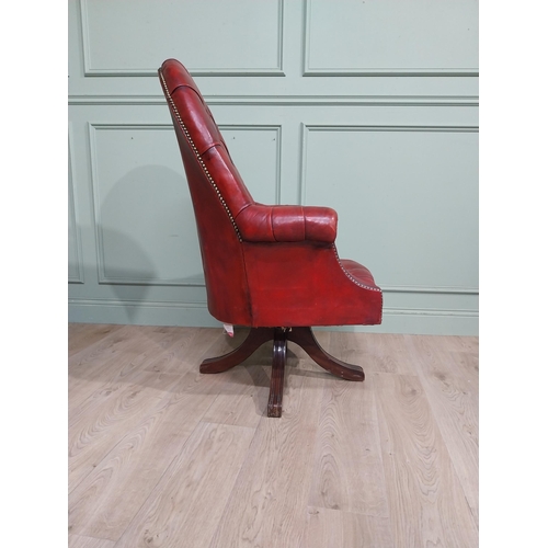 90 - Good quality hand dyed French oxblood leather deep buttoned swivel office chair raised on four splay... 