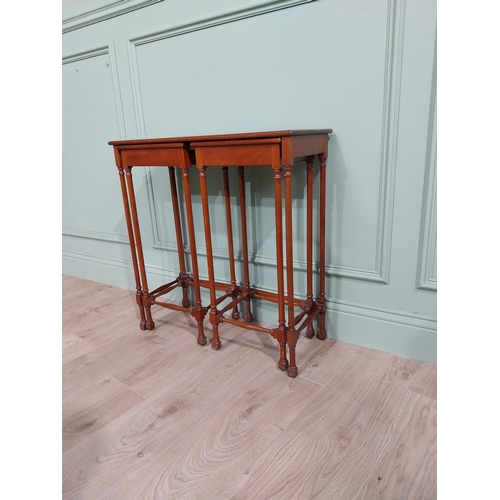 97 - Nest of three tables in the Regency style with turned legs and stretchers. {70 cm H x 67 cm W x 28 c... 