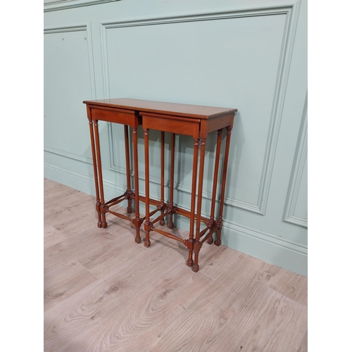 97 - Nest of three tables in the Regency style with turned legs and stretchers. {70 cm H x 67 cm W x 28 c... 