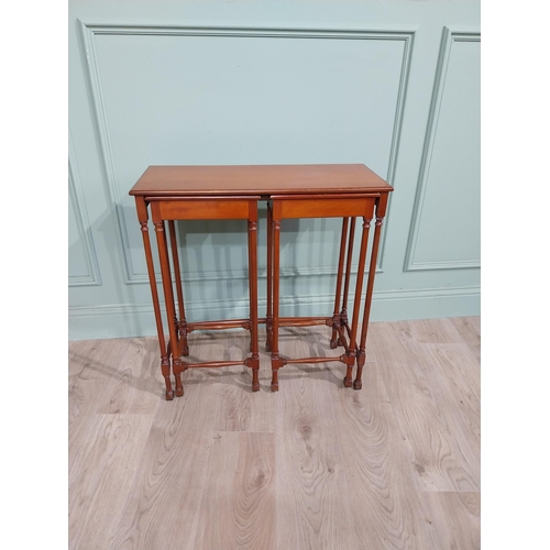 97 - Nest of three tables in the Regency style with turned legs and stretchers. {70 cm H x 67 cm W x 28 c... 