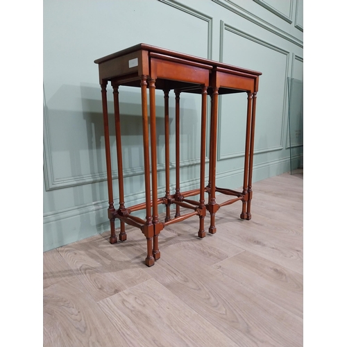 97 - Nest of three tables in the Regency style with turned legs and stretchers. {70 cm H x 67 cm W x 28 c... 