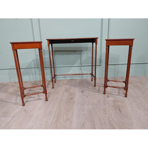 97 - Nest of three tables in the Regency style with turned legs and stretchers. {70 cm H x 67 cm W x 28 c... 