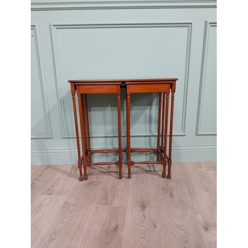 97 - Nest of three tables in the Regency style with turned legs and stretchers. {70 cm H x 67 cm W x 28 c... 