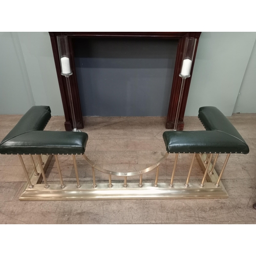 12 - Brass and green leather upholstered club fender with brass studs. {H 50cm x W 154cm x D 55cm Inside ... 