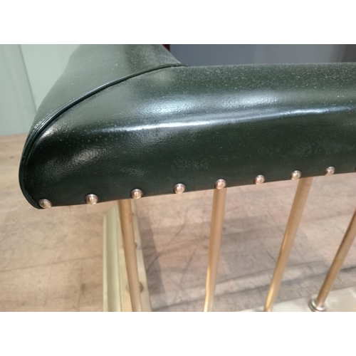 12 - Brass and green leather upholstered club fender with brass studs. {H 50cm x W 154cm x D 55cm Inside ... 