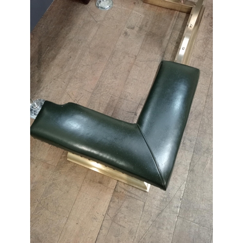 12 - Brass and green leather upholstered club fender with brass studs. {H 50cm x W 154cm x D 55cm Inside ... 