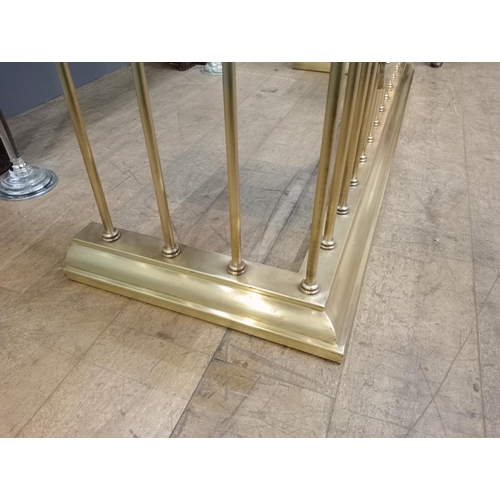 12 - Brass and green leather upholstered club fender with brass studs. {H 50cm x W 154cm x D 55cm Inside ... 