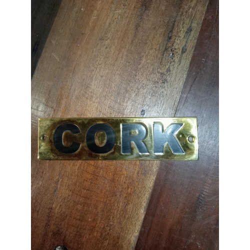 146 - Cork brass sign  {H 4cm x W 15cm }