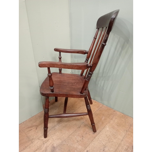 287 - Oak spindleback armchair raised on splayed feet. {H 103cm x W 56cm x D 66cm }