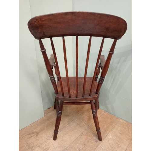 287 - Oak spindleback armchair raised on splayed feet. {H 103cm x W 56cm x D 66cm }