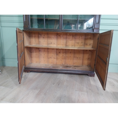 319 - Early 20th C. Original scumbled pine bookcase with two long glazed doors flanked by inset columns ov... 