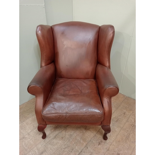 73 - Laura Ashley leather upholstered wingback armchair raised on cabriole legs.  {H 104cm x  W 80cm x D ... 