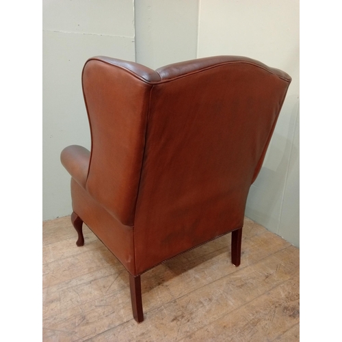 73 - Laura Ashley leather upholstered wingback armchair raised on cabriole legs.  {H 104cm x  W 80cm x D ... 