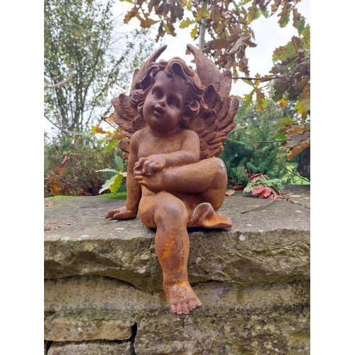 379 - Cast iron Cherub {40 cm H x 21 cm W x 25 cm D}.