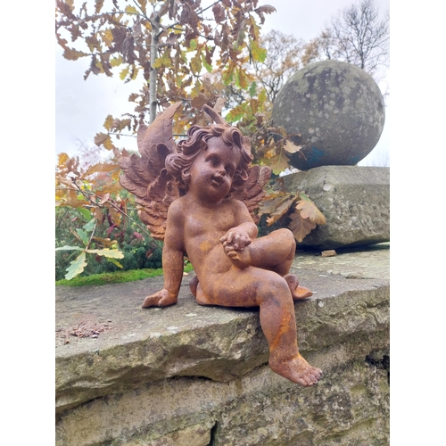 379 - Cast iron Cherub {40 cm H x 21 cm W x 25 cm D}.