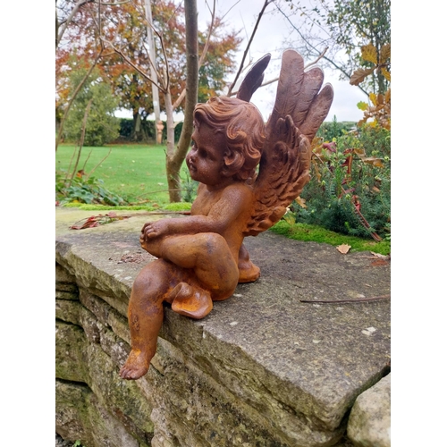 379 - Cast iron Cherub {40 cm H x 21 cm W x 25 cm D}.